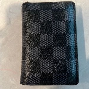 Very used Louis Vuitton Pocket Organizer. stretched pockets